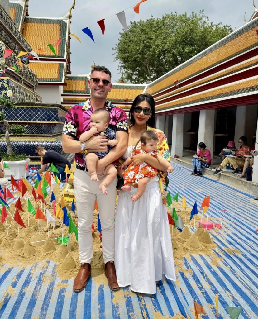 Dr. Bart Scanlon and wife Airada standing with Twins on holiday